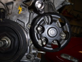 Lower 3 bolts are accessed through the pulley