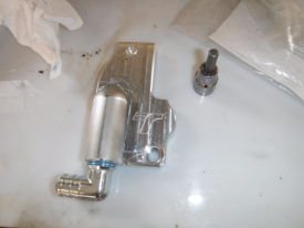 Elbow installed using loctite, although I assume thread sealant would work