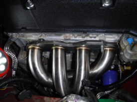 Put the header on and then reinstall the studs