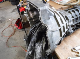 I stuck a trashbag inside the bellhousing
