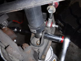 It may be easier to simply remove the coilover