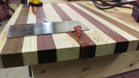 As before, removing the bulk of the glue with a scraper