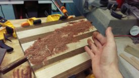 Put glue in the cracks and rub in sawdust