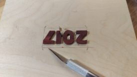 Use the x-acto knife to cut around the letters as deeply as possible
