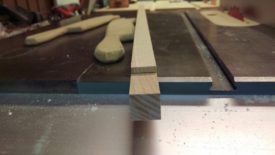 Button material trimmed to width