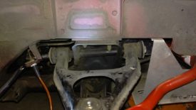 Remove the long bolt with a couple of wrenches