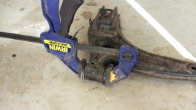 A clamp or bench vise can force the bushings in