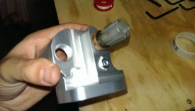Use pipe sealant (not tape as pictured) and install plugs in the rear cover
