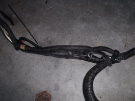 This ugly zip tie thing provides strain relief