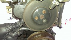 The water pump pulley comes out with these three bolts