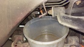 Soft line removed, hard line draining into bucket