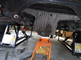 Shift it to one side to remove the other axle, then switch