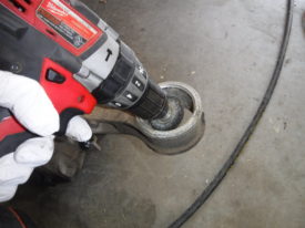 Using a wire brush to clean the bores