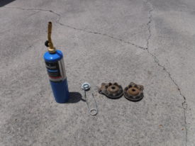 A propane torch separates the rubber from steel