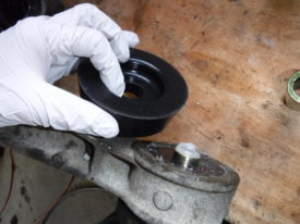 The bottom should stick out for the other half of the bushing, pictured