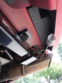 Angled so that it would go through and come out near the hole