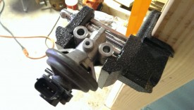 Drill an appropriately sized hole with the valve in a small vise