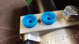 These caps cover the hydraulic ports