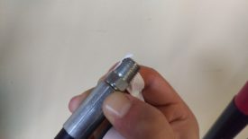 Apply Teflon tape to the male end of the short hose
