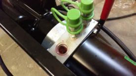 Turn the power unit on its side so the relief valve faces up, then remove the cap