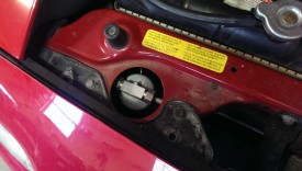 Receiver/drier location in a miata
