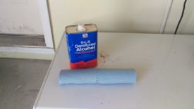Wipe with some sort of alcohol, such as denatured pictured here