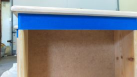 Tape off any areas that shouldn't be stained with painter's tape