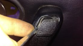One screw is behind this plastic insert