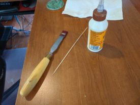 Required items are a drill, chisel, wood glue, and dowel