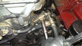 Lock bolt for power steering tensioner