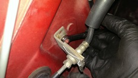 Clutch line bracket behind EGR valve / intake