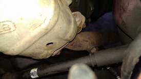 Upper downpipe bolts, two of three are pictured