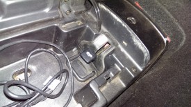 Pull console off around gas cap and trunk levers