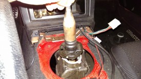 Shifter simply pulls up with the lower boot unbolted