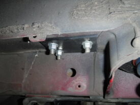 Upper bolts come through into the fender here