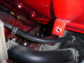 Driver's side bolts are behind the gas filler cover, if you have it installed