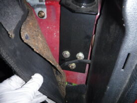 Lower bolts go right behind the seats here