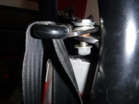 The seatbelt bolt should now be accessible from the bottom and top