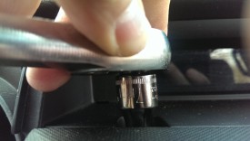 I used a 7mm socket to remove both bolts