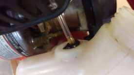 Push the grommet down into the tank