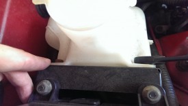 These two bolts allow the washer tank to come out