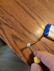 I used a small screwdriver to depress each pin's tab