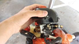 Unscrew the orange screw to remove the air filter cover