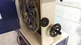 The large wheel on the right adjusts tension