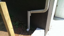 The downspout had to be redirected over