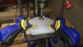 Using the mark to center the press, drill out the 30mm hole