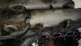 Removing the valve cover by undoing all of these small bolts