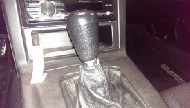 The shift knob simply unscrews by being twisted