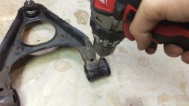 You can drill through the bushing if you missed the center