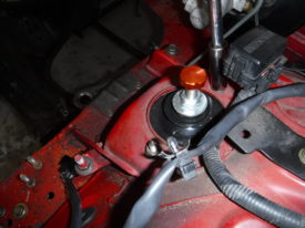 Unbolting the two OUTER coilover bolts